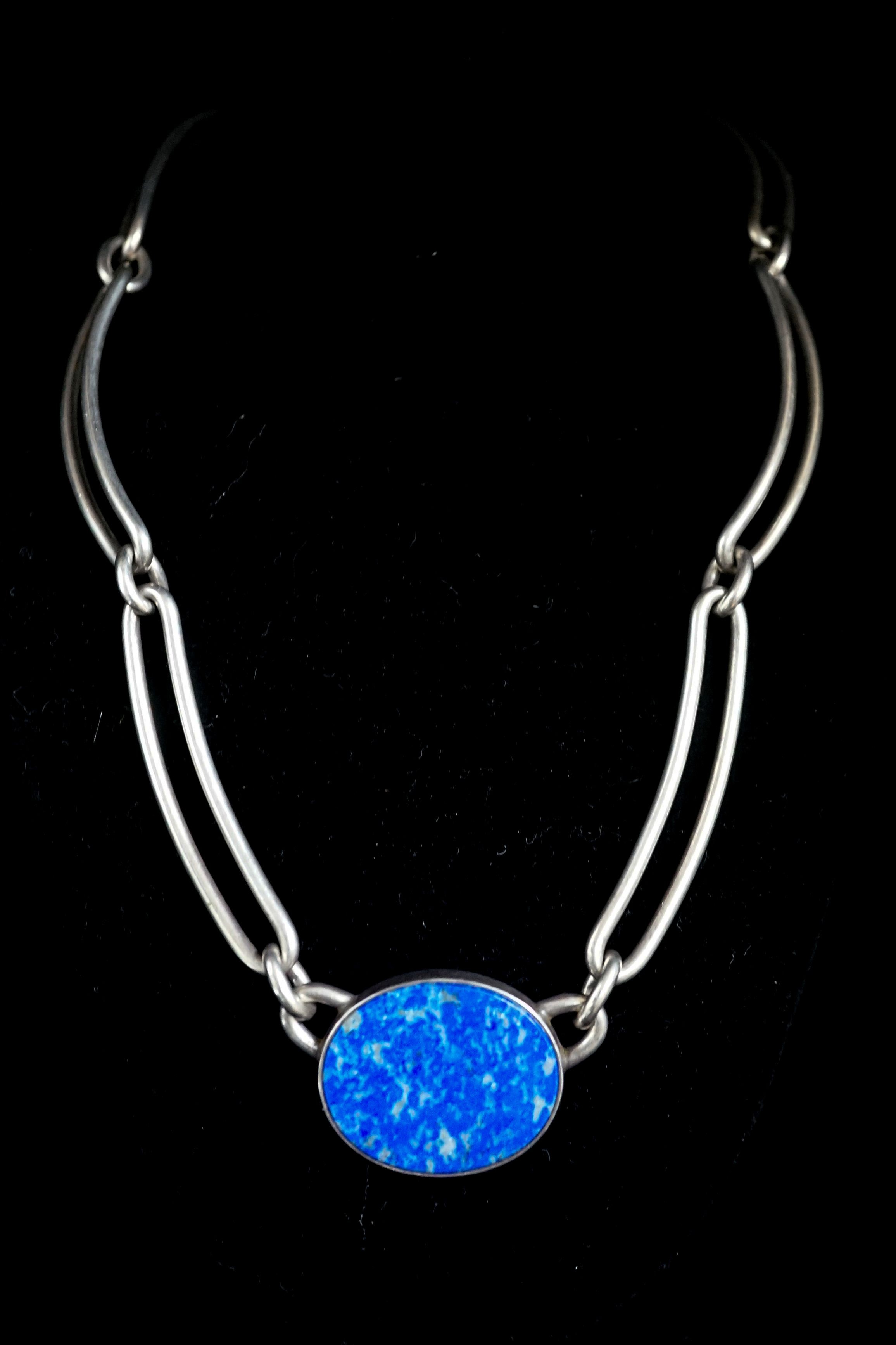 A 1980's Danish sterling 925 and lapis lazuli set necklace by N.E. From, 38cm and a white metal and lapis lazuli set bracelet.